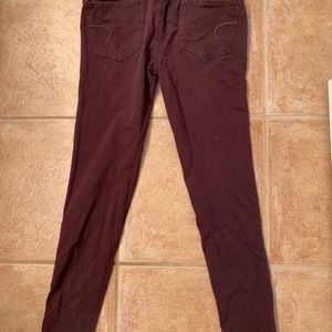 A maroon skinny jean